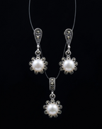 "Royal Lustre" Pearl Drop Set: Emphasizes the regal and sophisticated look of the pearls.